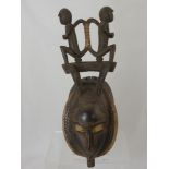 A West African (Cote d' Ivoire) Yaoure Funeral Mask, this oval mask depicts two monkeys (to