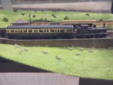 A Diorama Scale Model of the 'Chalford Flyer', contained within a glass case, together with two