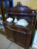 A Mahogany Victorian Chiffonier, serpentine front with carved upper shelf on barley twist