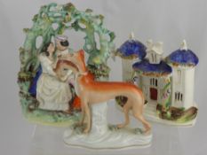 A 19th Century Flatback Figure of Young Lovers, seated beneath a bough together with a Staffordshire