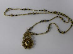 An Antique 9 Ct Gold and Black Bead Philippino Necklace, the necklace having gold filigree beads