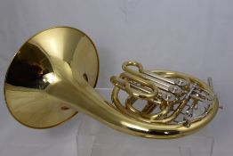 A J. Michael (Japanese) Brass French Horn, in the original fitted case.