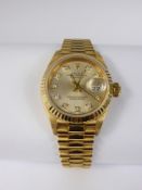 A Lady's 18 ct Yellow Gold Rolex Oyster Perpetual Datejust, the watch having a gold face with