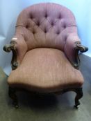 A French Mahogany Button Back Arm Chair, the chair having swept arm supports on cabriole legs with