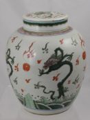 A Chinese Ginger Jar and Cover, hand painted with chasing dragons and flaming pearls of wisdom,