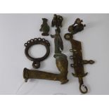 A Small Quantity of Nigerian Bronze Manila Bracelet Currency, including a pipe, ring, figures and