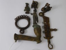 A Small Quantity of Nigerian Bronze Manila Bracelet Currency, including a pipe, ring, figures and