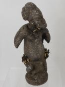 A West African Terracotta Yoruba Hunting Figure, depicted as a successful hunter of antelope, approx