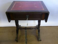 A Mahogany Drop Leaf Table, with tooled red leather top, single drawer, supported on reeded legs and