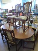 An 'Old Charm' Dining Room Table, four chairs and two carvers.