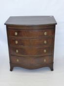 A Small Oak Bow Fronted Chest of Drawers, with four drawers on bracket feet, approx 84 x 76 x 52.5