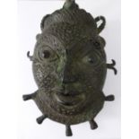 A Bronze Cast Tikar Mask (Pygmy People) the mask finely crafted, with green patina, approx 26 x 17