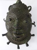 A Bronze Cast Tikar Mask (Pygmy People) the mask finely crafted, with green patina, approx 26 x 17