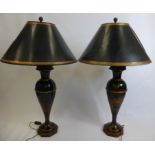 A Pair of Chinese Style Lamps Bases with Black Shades, depicting Oriental figures in a garden
