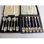 A Set of Solid Silver Commemorative Teaspoons together with a set of solid silver filigree