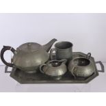 A Hammered Pewter Tea Set, together with two boxes of Viner's Cutlery.