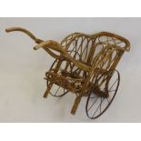 A Victorian Bent Cane Dolls Pram, in the form of a luggage trolley, approx 95 x 35 cms