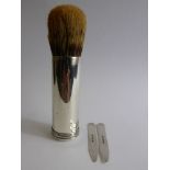 A Solid Silver Shaving Brush and Holder, the cylindrical holder in the form of a cartridge,