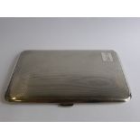 A Solid Silver Cigarette Case, the engine turned case London hallmarked, dd 1935,  mm T W L,