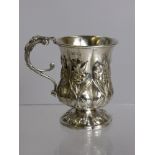 A Solid Silver William IV Christening Cup, the cup decorated with flowers to body, foot and handle