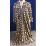A Lady's Hand Made Kaftan, embroidered with floral design gold on black ground.