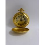 A Lady's Gold Metal Full Hunter Pocket Watch, the watch having leaf decoration with black enamel