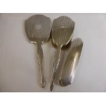 A Silver Topped Dressing Table Set, comprising mirror, hand brush, clothes brush, unmarked