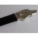 A Silver Handled and Ebony Page Turner, the turner having a handle in the form of a spaniel,