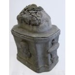 An 18th Century Lead Tobacco Jar and Cover, with decoration in relief, approx 15 cms high. .