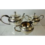 An Early 20th Century Japanese Sterling Silver Tea Trio, comprising tea pot, sugar bowl and milk jug
