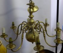 An Antique Eight Branch Brass Dutch Style Chandelier, central ball on turned column with eight