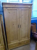 A Pine Wardrobe with Two Doors, hanging rail with large drawer to base, approx 105 x 150 cms