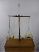 A Vintage Anometer in the original box, together with oak cased apothecary scales and S. Mawson &