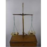 A Vintage Anometer in the original box, together with oak cased apothecary scales and S. Mawson &