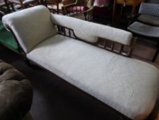 A Victorian Chaise Longue, with spindle back and cushion support, cream upholstery.