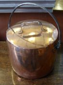 A Fireside Copper Cooking Pot and Lid.