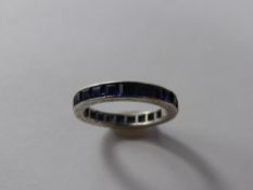 A Lady's 18 Ct White Gold Sapphire Full Eternity Ring. 24 x sapps, 2.5 mm, size L, 2.2 gms.