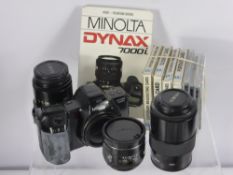 A Minolta Dinax 7000 i No. 16323609 Camera, with instruction manual and custom sling strap,