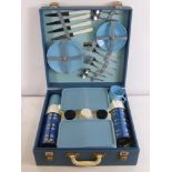 A Vintage Sirram Picnic Set, complete with four cups, four saucers, four plates, two sandwich boxes,