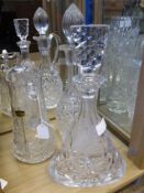 Two Cut Glass Claret Decanters, together with a Polonia lead crystal and glass water jug. (3)