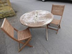 A Timber Garden Set, comprising of round table and four chairs.