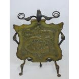 An Arts & Crafts Hammered Brass and Wrought Iron Fire Screen, depicting a chasing dragon, approx