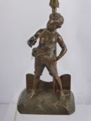 A Bronzed Lamp Base, depicting a boy playing a pipe, approx 36 cms high.