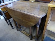 An Oak Gate Leg Table, circa 1920, approx 78 x 105 x 76 cms.