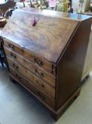 A Mahogany Drop Front Bureau, four graduated drawers with fitted interior, supported on bracket feet