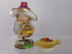 A Porcelain Mansion House Dwarf, depicted wearing a bold waistcoat and a lavender hat, with red