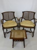 Two Cane Seated Mahogany Effect Art Deco Arm Chairs, together with foot stool.(3)
