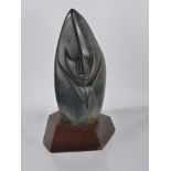 A Polished Soapstone Inuit Carving, depicting a mask of simplistic form, approx 16 cms, mounted on a