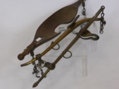 Vintage Agricultural Equipment, including a hoe, cattle yolk and brass plough- horse stays. (3)