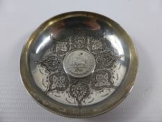 A Silver Persian Pin Dish, having a coin inserted to the centre.